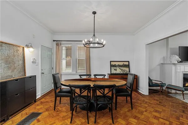 a dining room with furniture and window