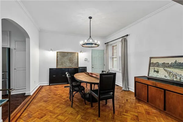 a dining room with furniture and window