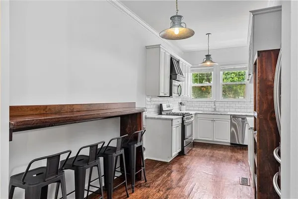 a kitchen with sink cabinets and window