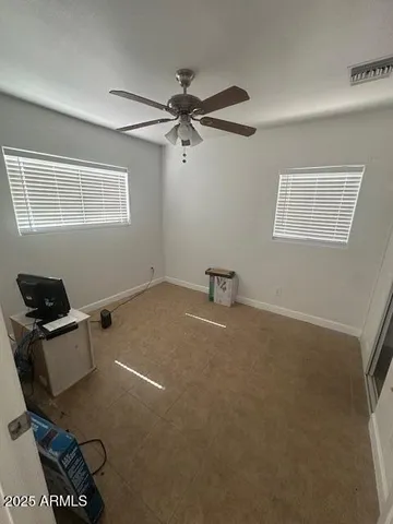 a room with furniture and air conditioner vent