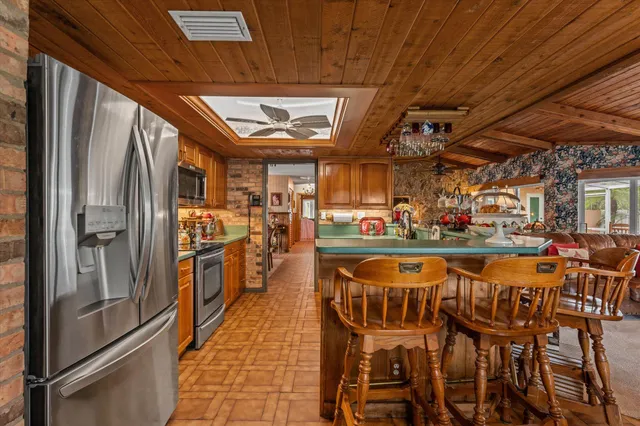 a bedroom with a bed dresser and a window