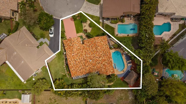 an aerial view of a house with a garden