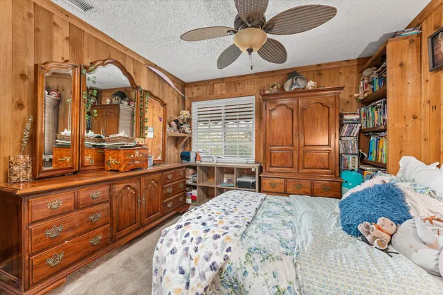 a view of a patio with a dining table and chairs