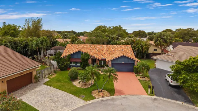 a group of people sitting in front of a house