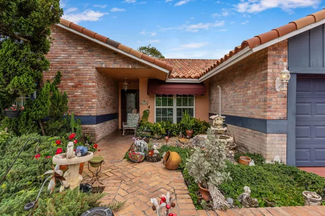 a swimming pool with view of outdoor seating