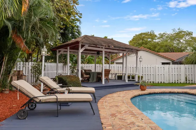 a view of a swimming pool with a patio