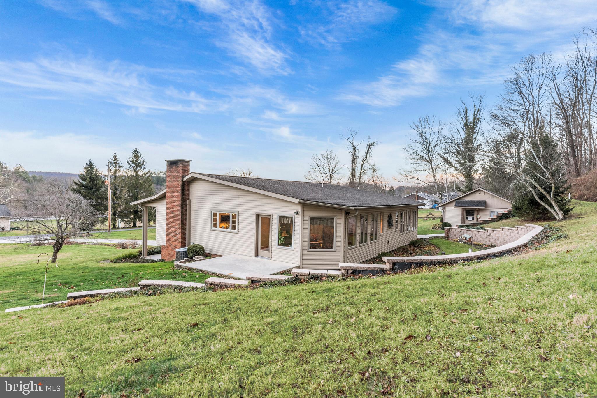 125 Housel Road Hopewell, PA 16650 - Photo 101 of 105 a front view of house with yard and green space
