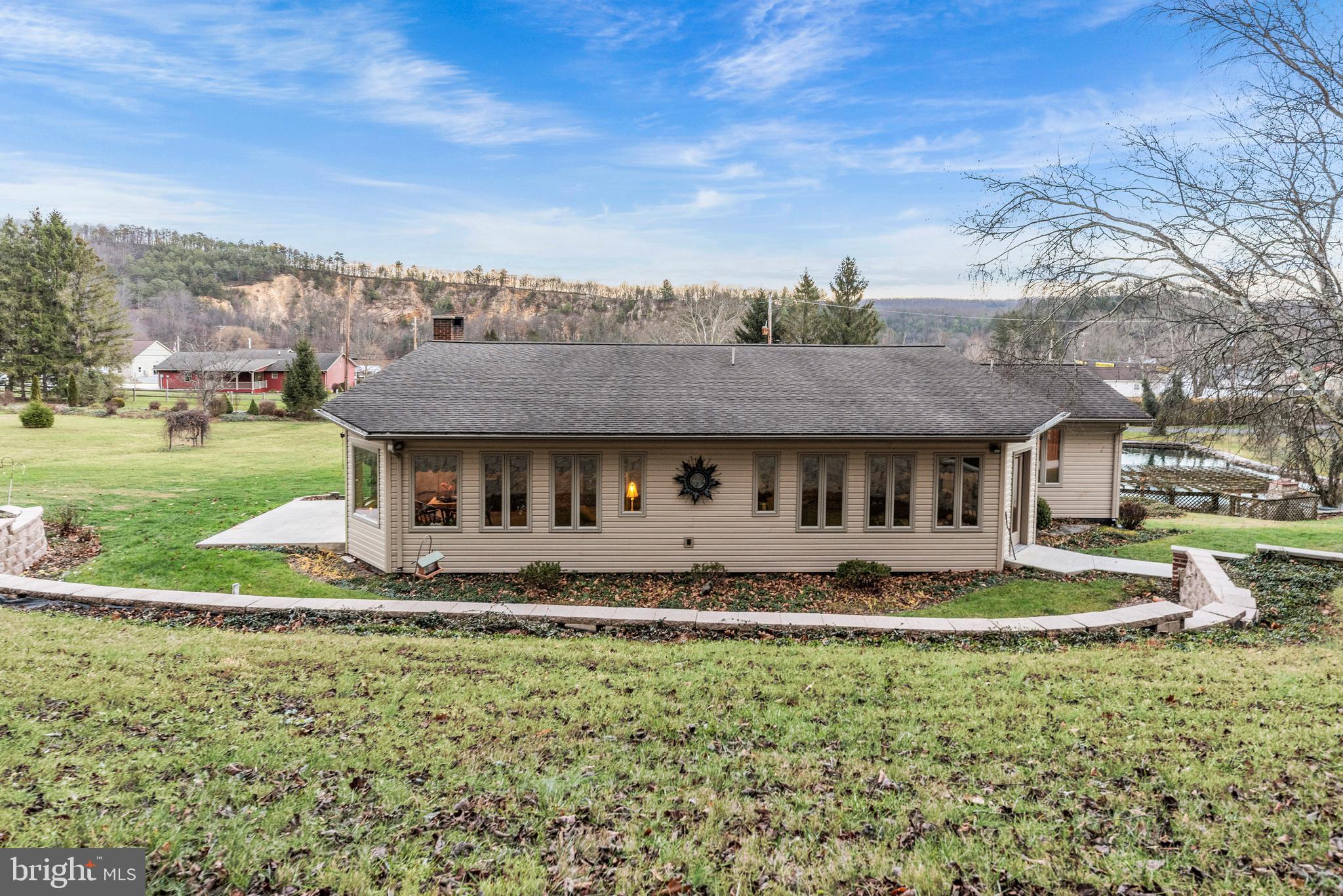 125 Housel Road Hopewell, PA 16650 - Photo 102 of 105 a front view of a house with a yard