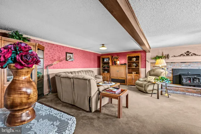 a kitchen with stainless steel appliances granite countertop a stove refrigerator sink and cabinets