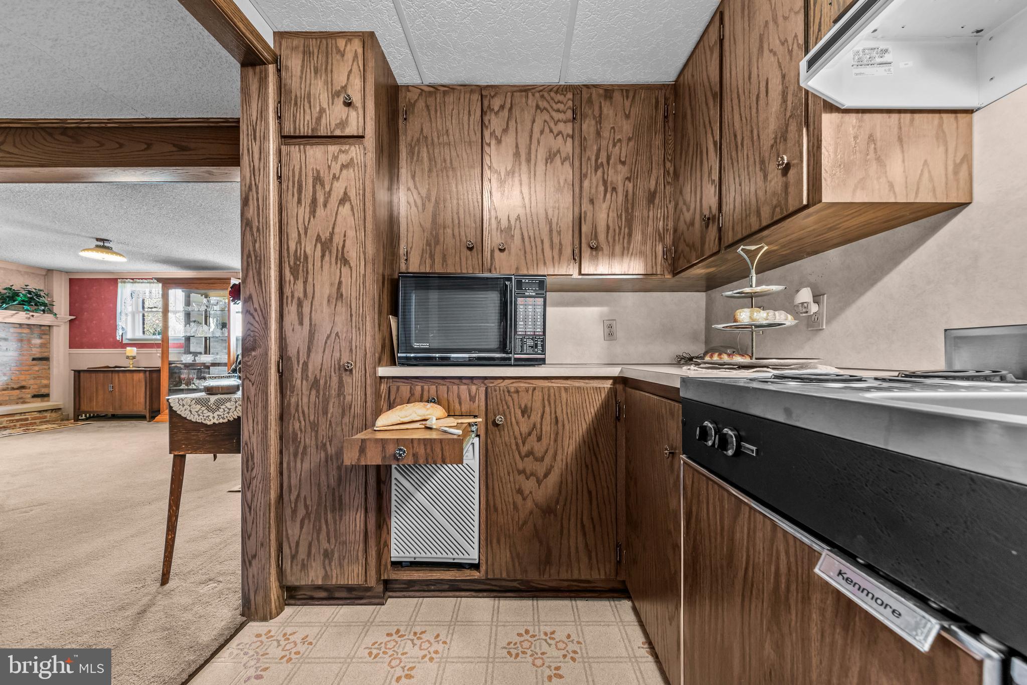 125 Housel Road Hopewell, PA 16650 - Photo 21 of 105 a kitchen with stainless steel appliances granite countertop a sink stove and cabinets