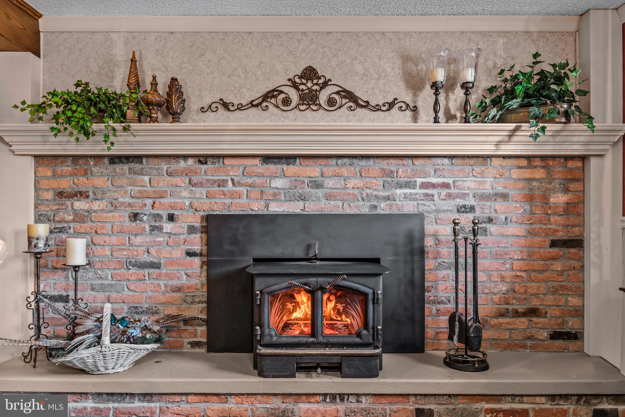 125 Housel Road Hopewell, PA 16650 - Photo 26 of 105 a close view of a fireplace with wooden floor