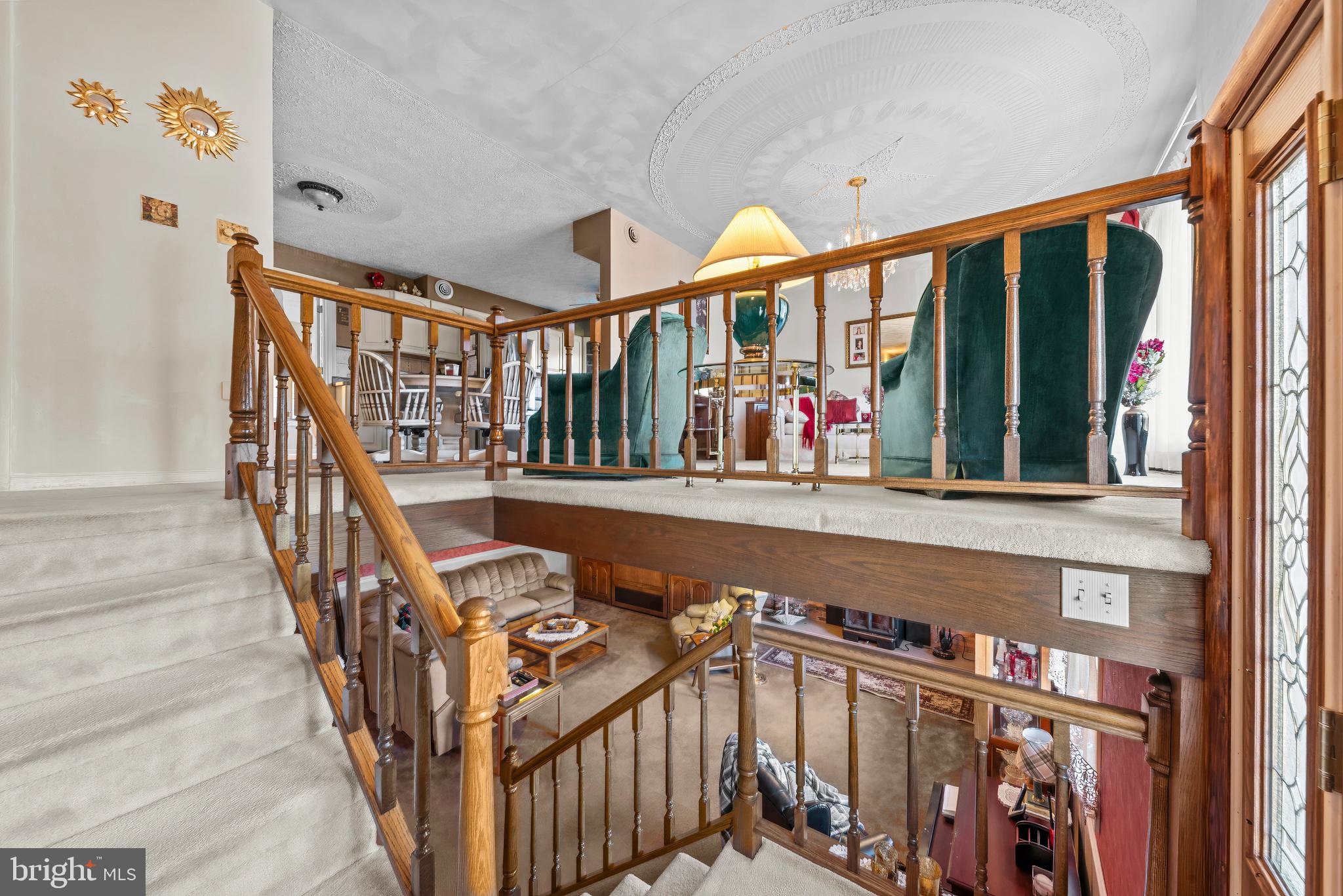 125 Housel Road Hopewell, PA 16650 - Photo 30 of 105 a view of staircase with lots of frames on wall and a large window