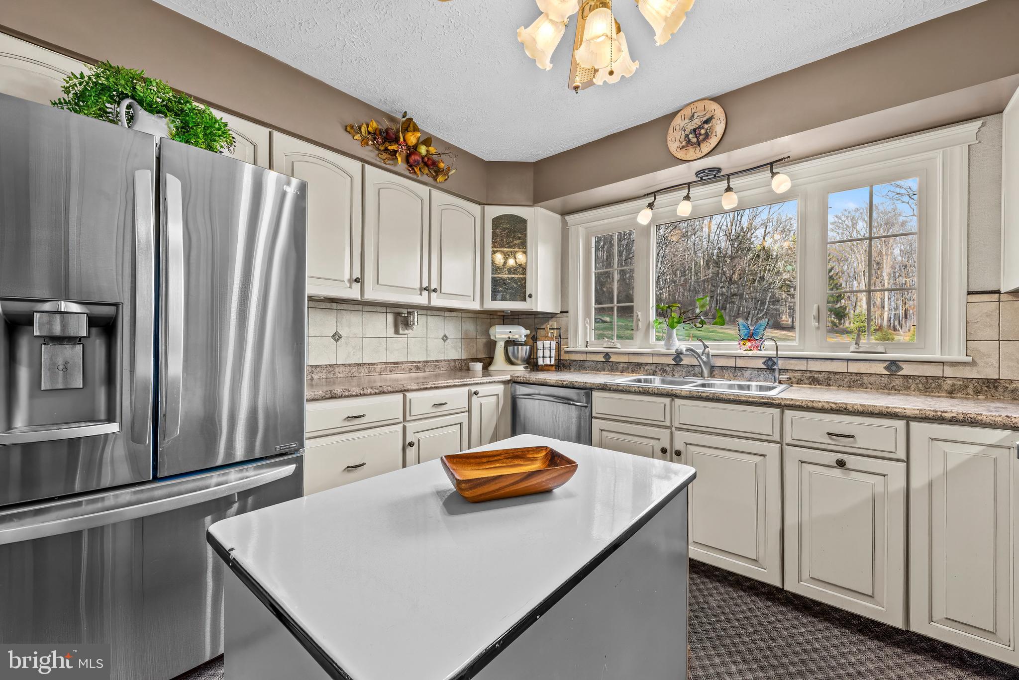 125 Housel Road Hopewell, PA 16650 - Photo 39 of 105 a kitchen with stainless steel appliances a refrigerator sink and cabinets