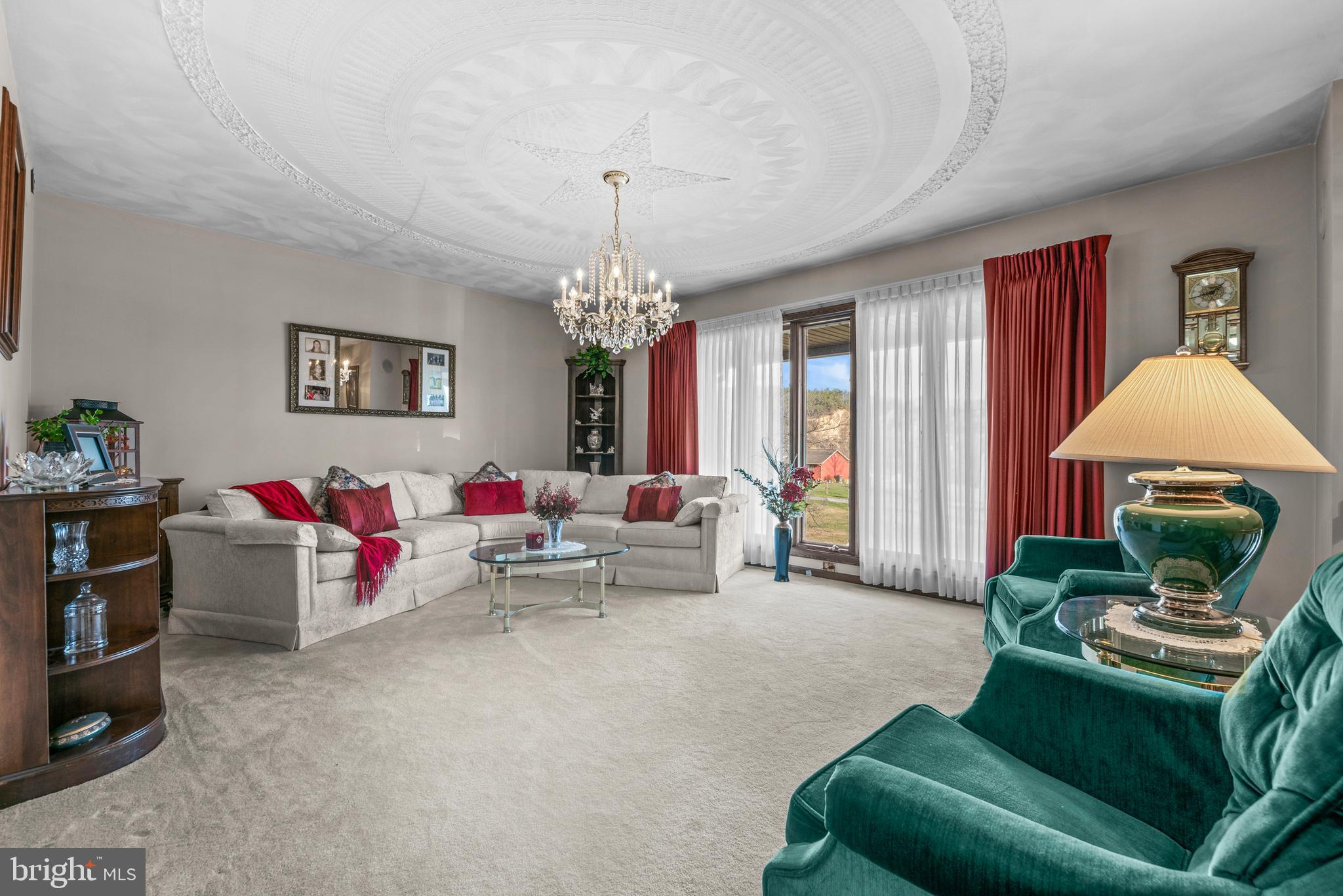 125 Housel Road Hopewell, PA 16650 - Photo 46 of 105 a living room with furniture and a chandelier