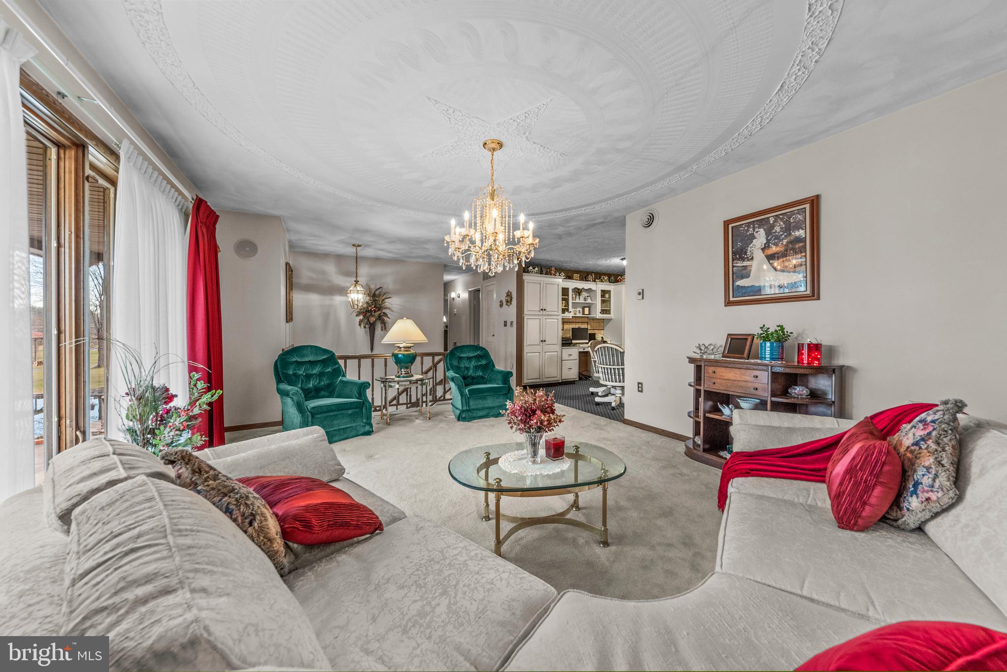 125 Housel Road Hopewell, PA 16650 - Photo 49 of 105 a living room with furniture and a chandelier