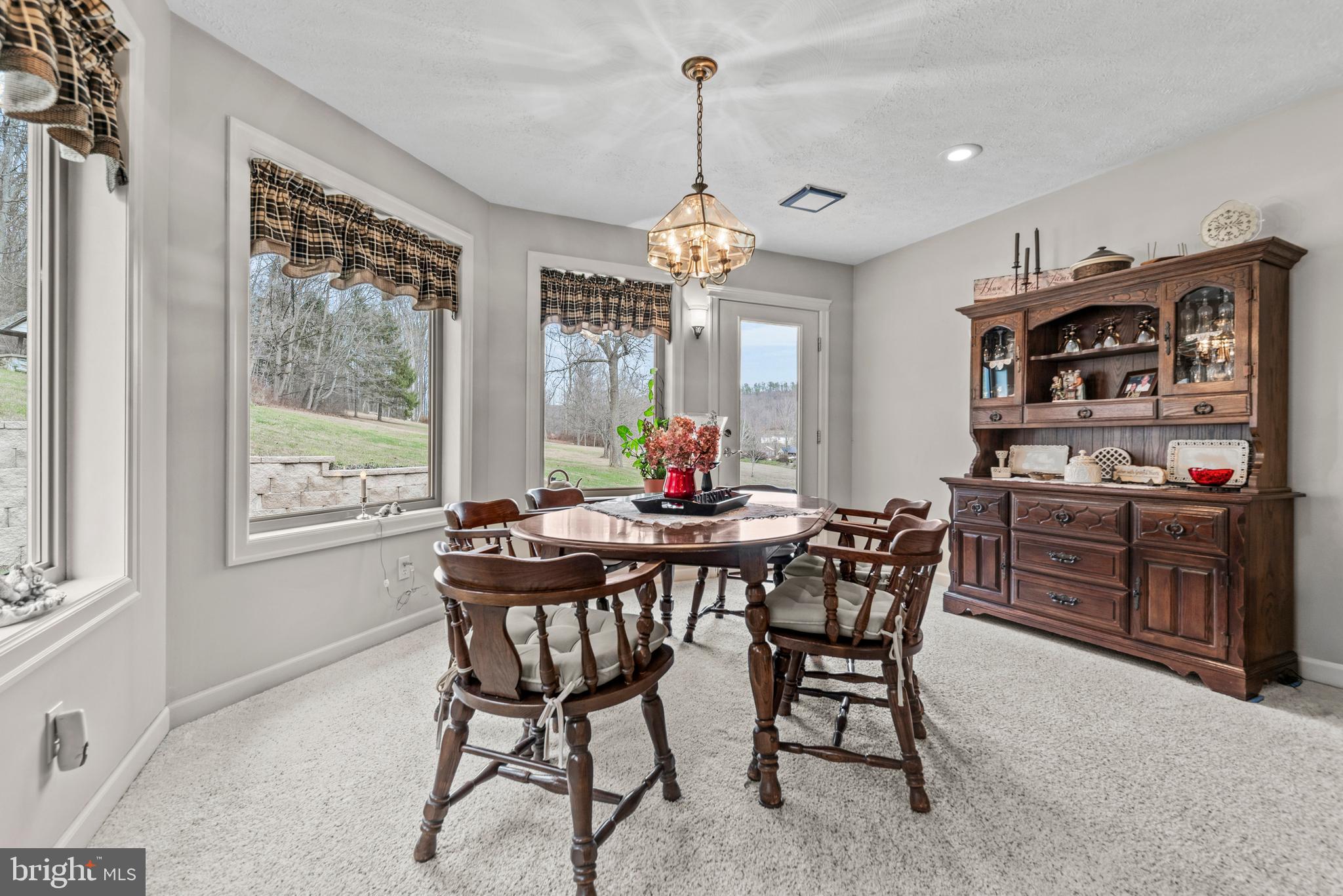 125 Housel Road Hopewell, PA 16650 - Photo 54 of 105 a view of a dining room with furniture window and outside view