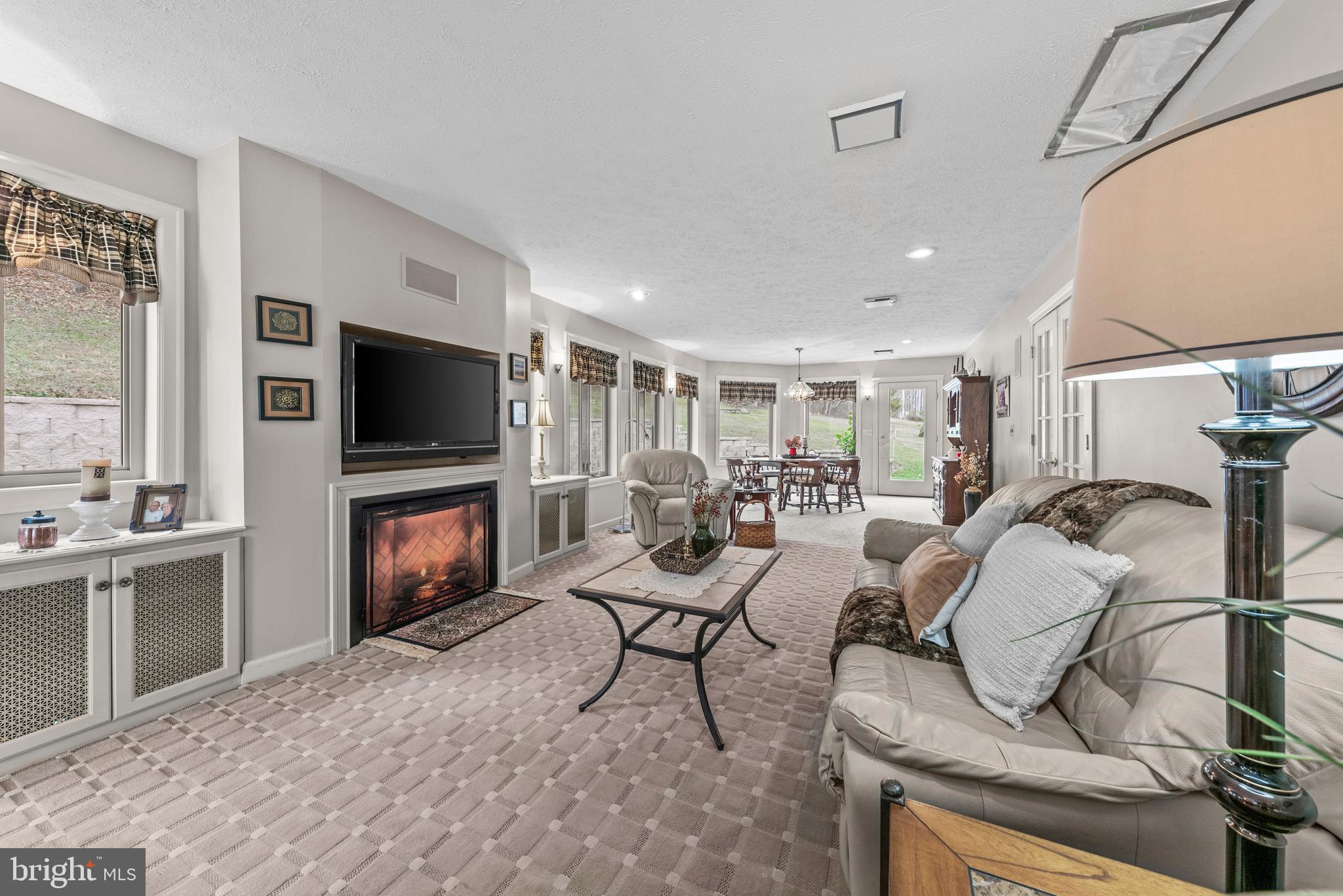 125 Housel Road Hopewell, PA 16650 - Photo 62 of 105 a living room with furniture and a flat screen tv