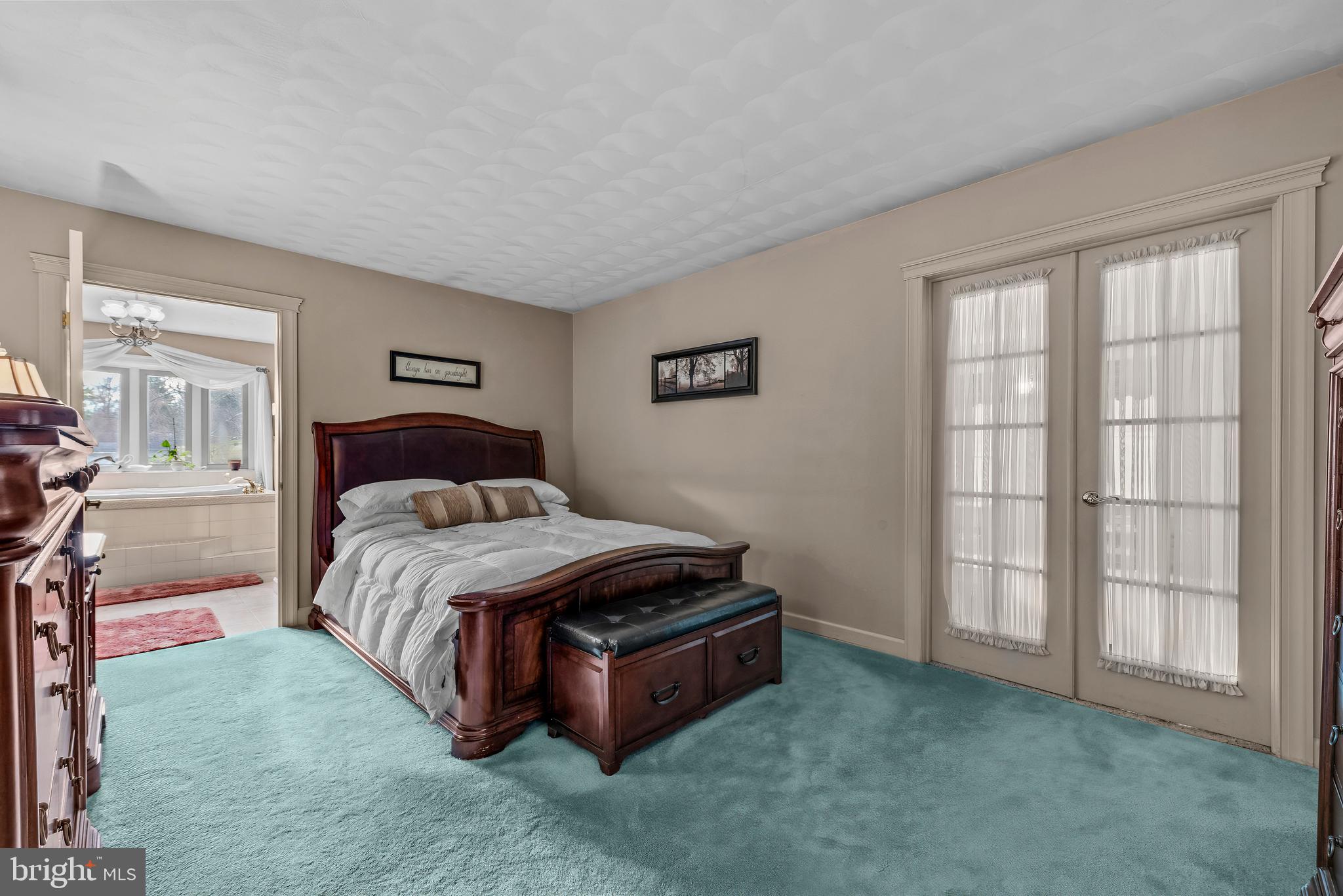 125 Housel Road Hopewell, PA 16650 - Photo 66 of 105 a spacious bedroom with a bed and a window