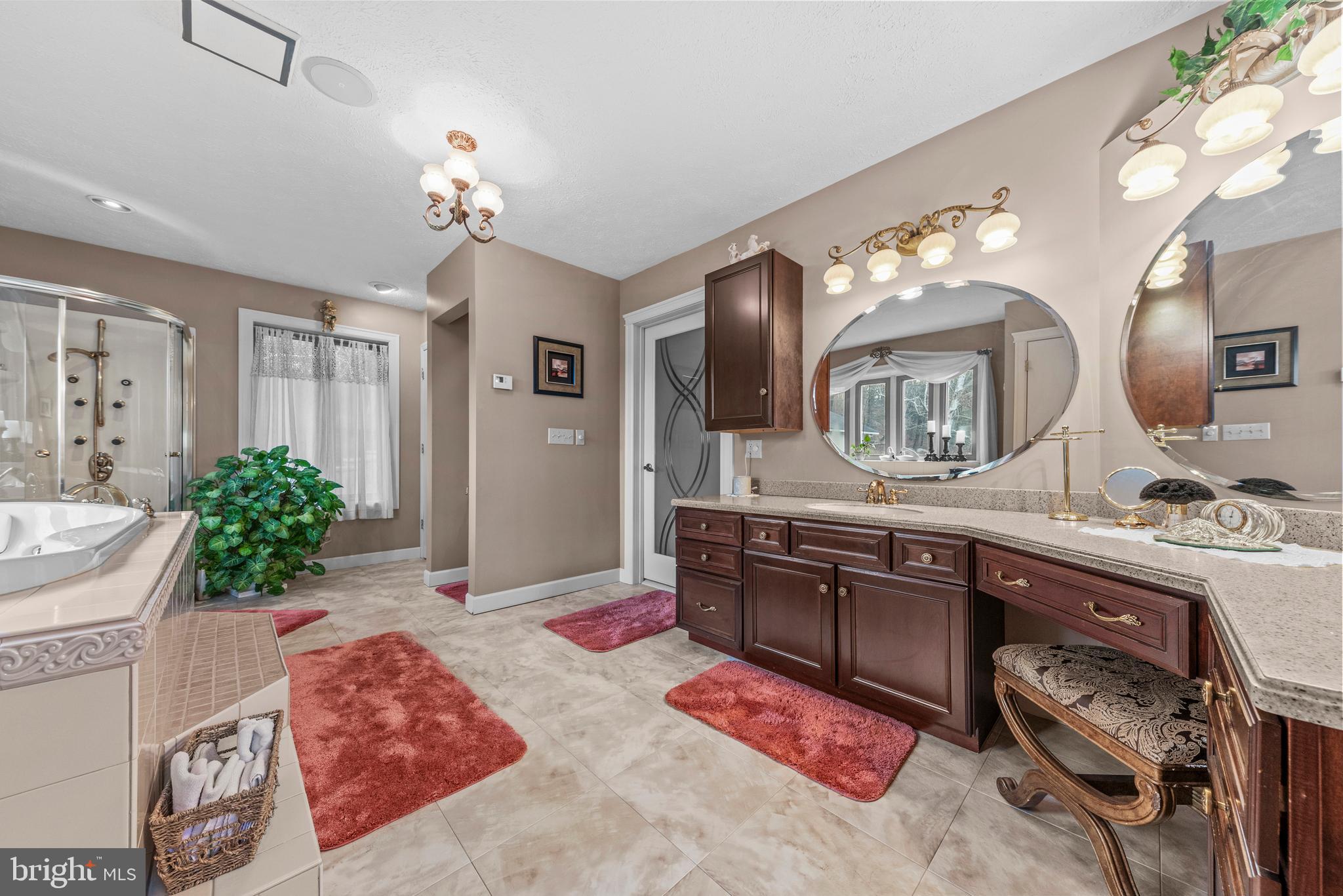 125 Housel Road Hopewell, PA 16650 - Photo 77 of 105 a spacious bathroom with a granite countertop sink a mirror and a shower