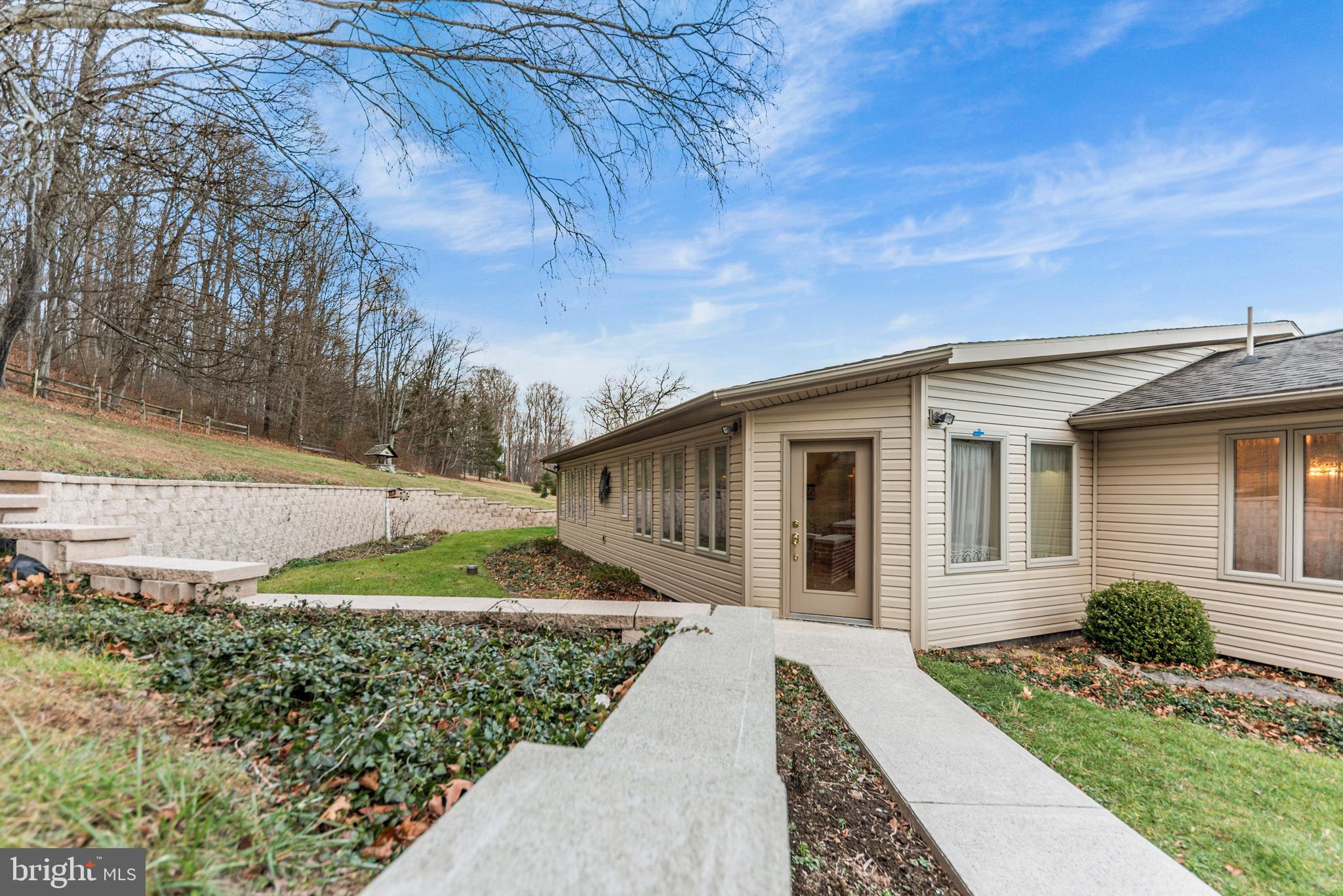 125 Housel Road Hopewell, PA 16650 - Photo 96 of 105 a front view of a house with garden