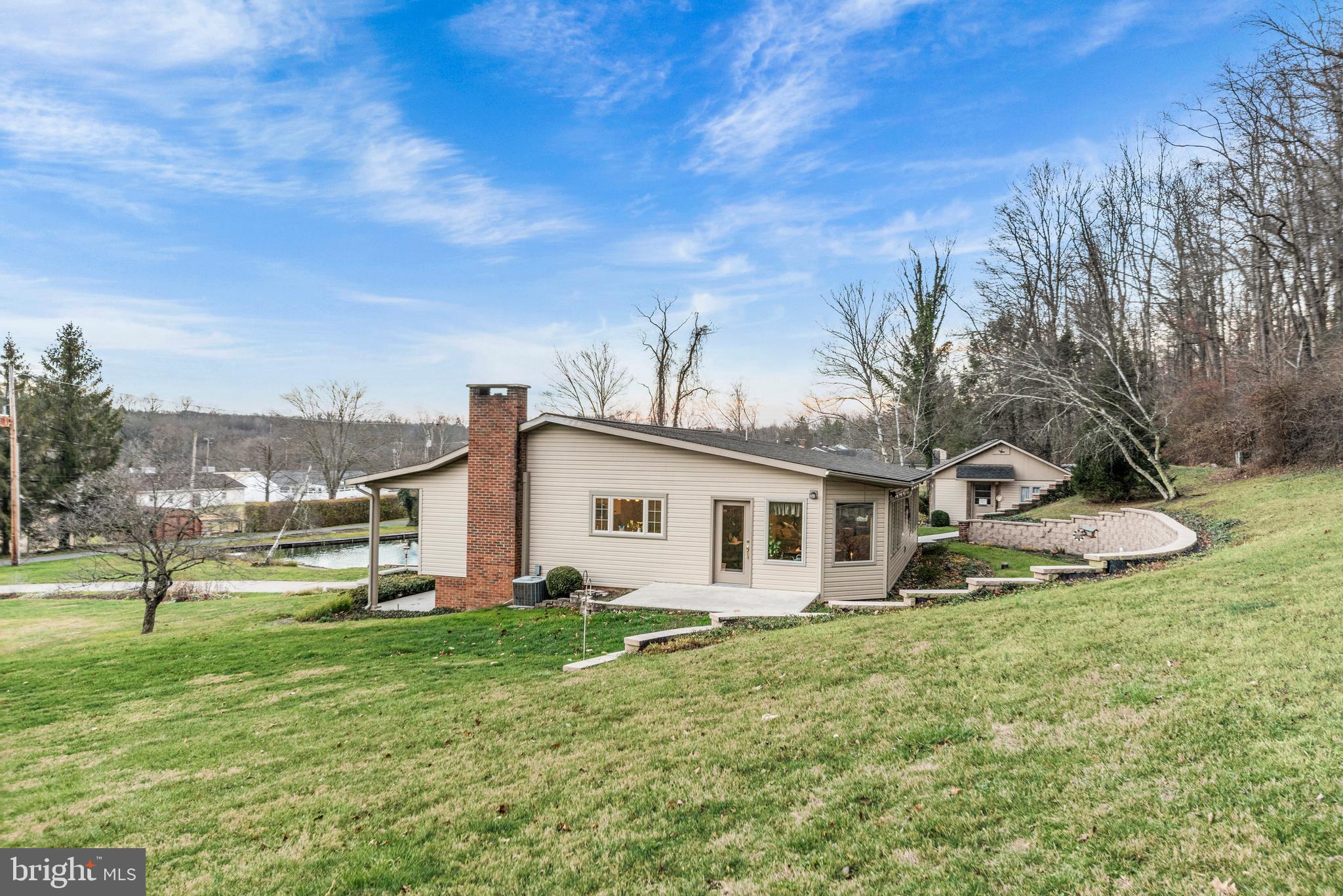 125 Housel Road Hopewell, PA 16650 - Photo 99 of 105 a view of a house with a yard