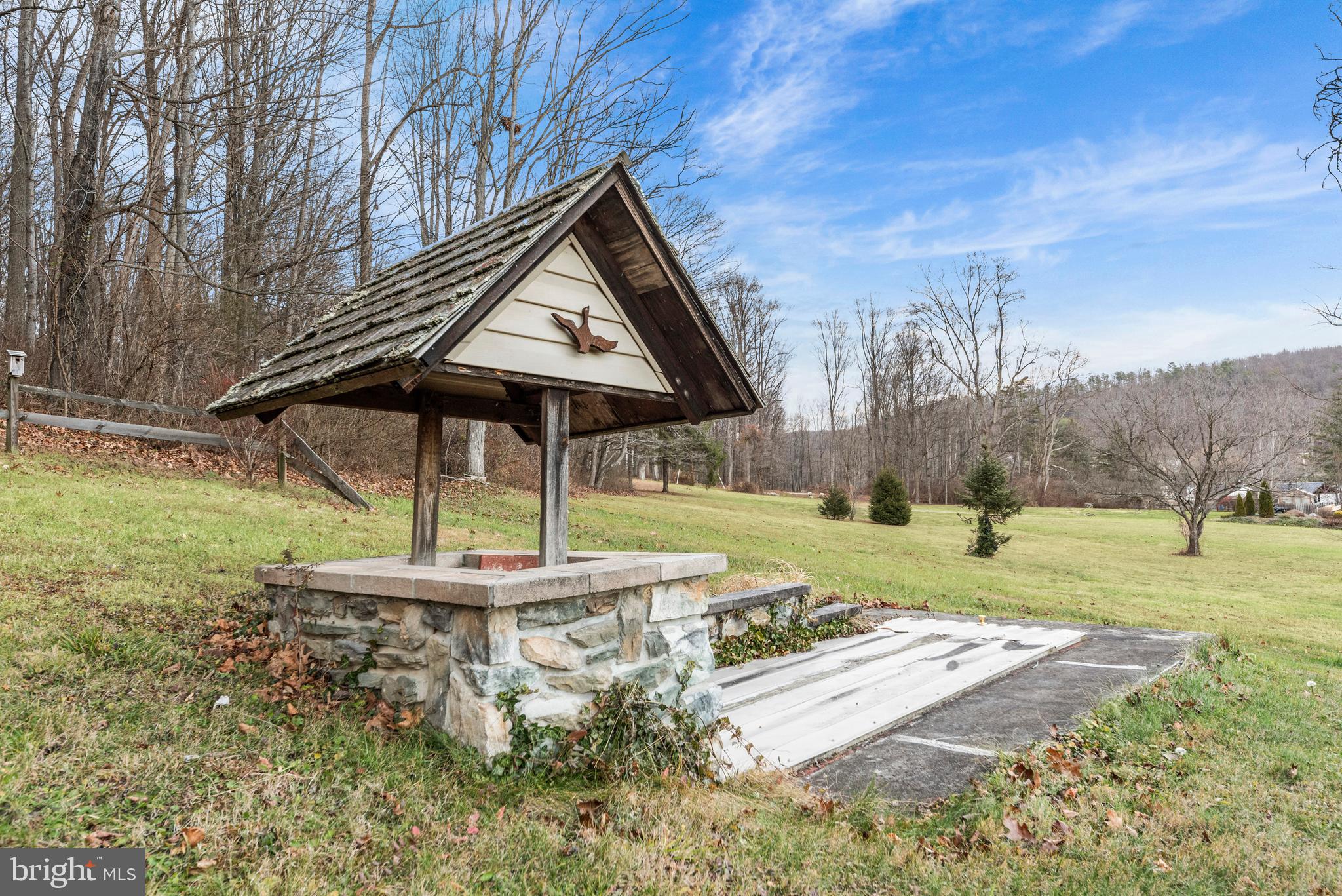 125 Housel Road Hopewell, PA 16650 - Photo 100 of 105 a backyard of a house with table and chairs