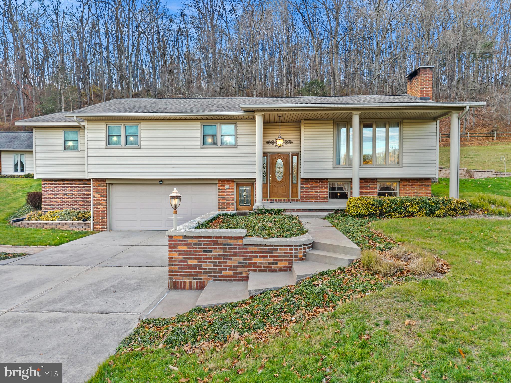 125 Housel Road Hopewell, PA 16650 - Photo 10 of 105 a front view of a house with garden