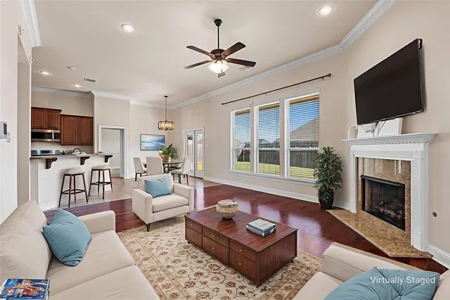 a living room with furniture fireplace and a flat screen tv