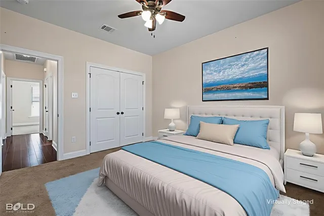 a bedroom with bed and window