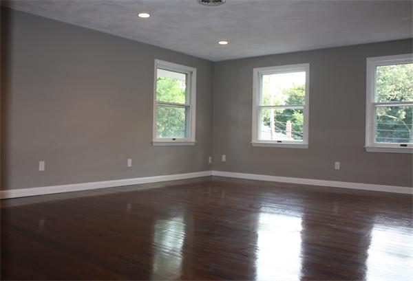 160 Parish Road Needham, MA 02494 - Photo 11 of 14 an empty room with wooden floor and windows
