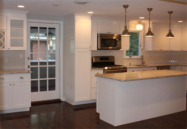 160 Parish Road Needham, MA 02494 - Photo 5 of 14 a kitchen with kitchen island granite countertop a sink cabinets and stainless steel appliances