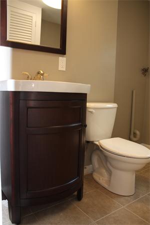160 Parish Road Needham, MA 02494 - Photo 7 of 14 a bathroom with a toilet a sink and mirror