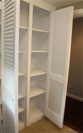 160 Parish Road Needham, MA 02494 - Photo 8 of 14 a view of walk in closet with empty racks