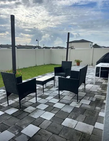 a view of house with backyard and swimming pool