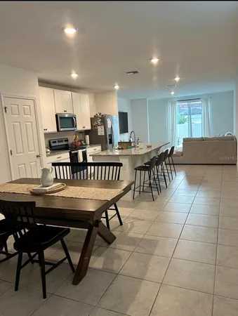 a living room with a couch and a flat screen tv