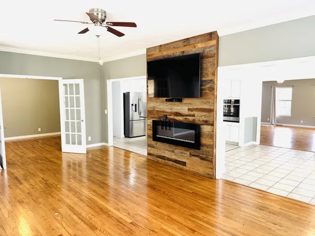 a bathroom with a sink vanity mirror and toilet
