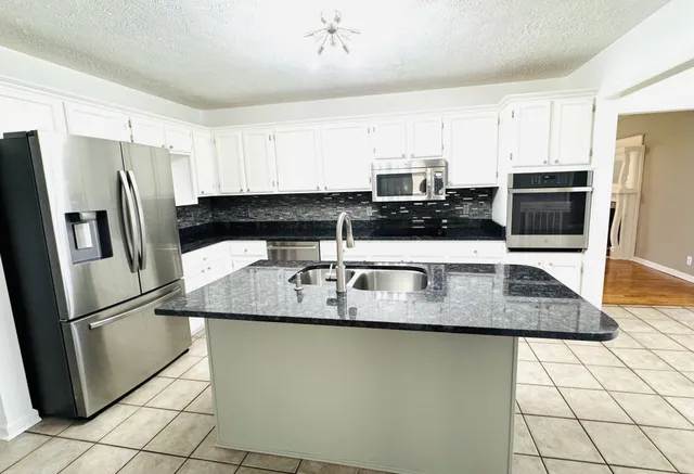 a view of livingroom with hardwood floor and a ceiling fan
