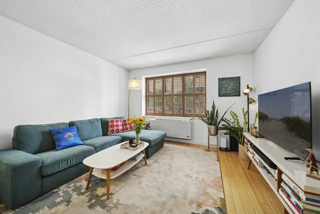 a spacious bathroom with a tub sink and toilet