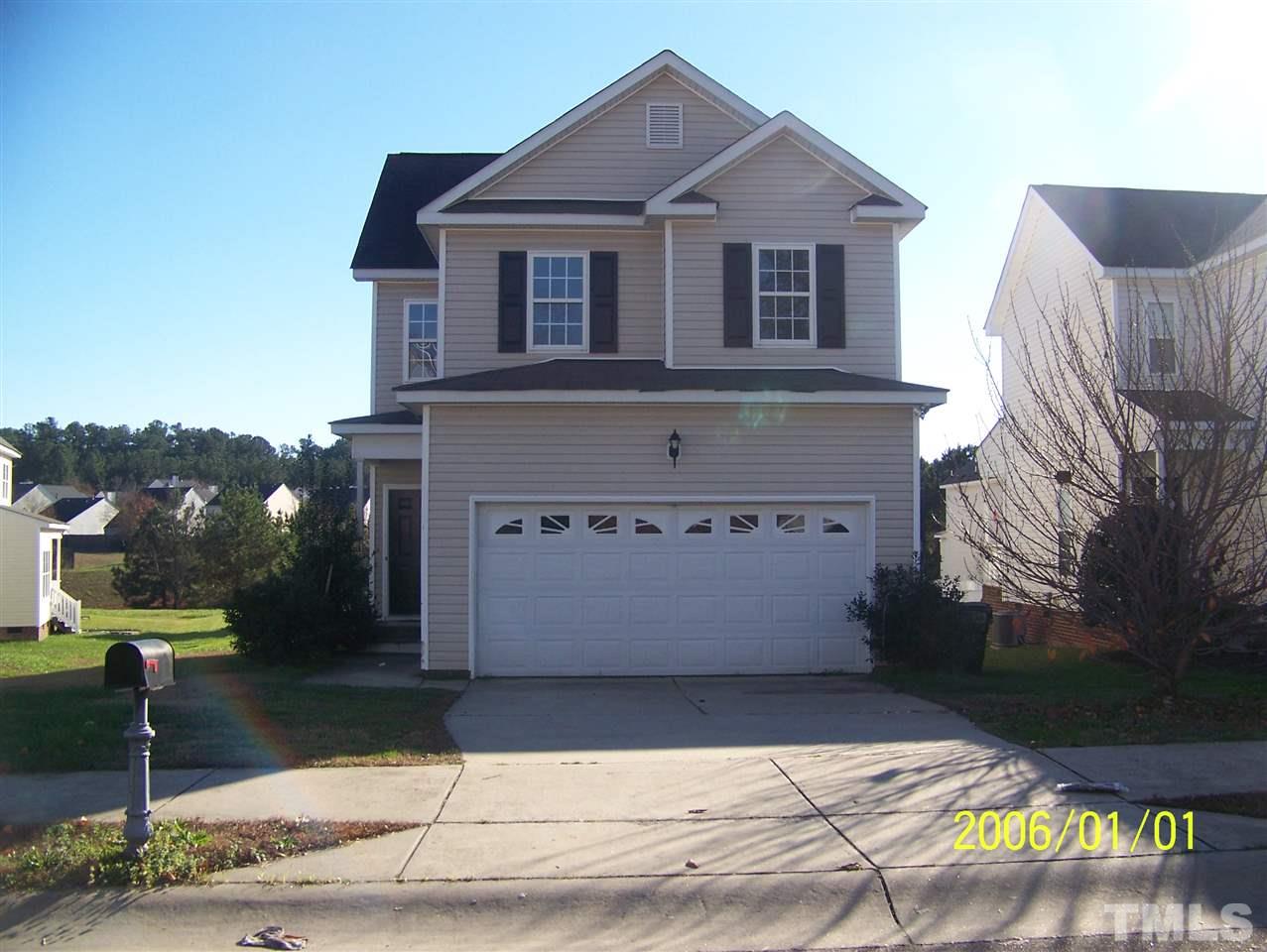 4244 Beacon Crest Way Raleigh, NC 27604 - Photo 1 of 6 a front view of a house with street