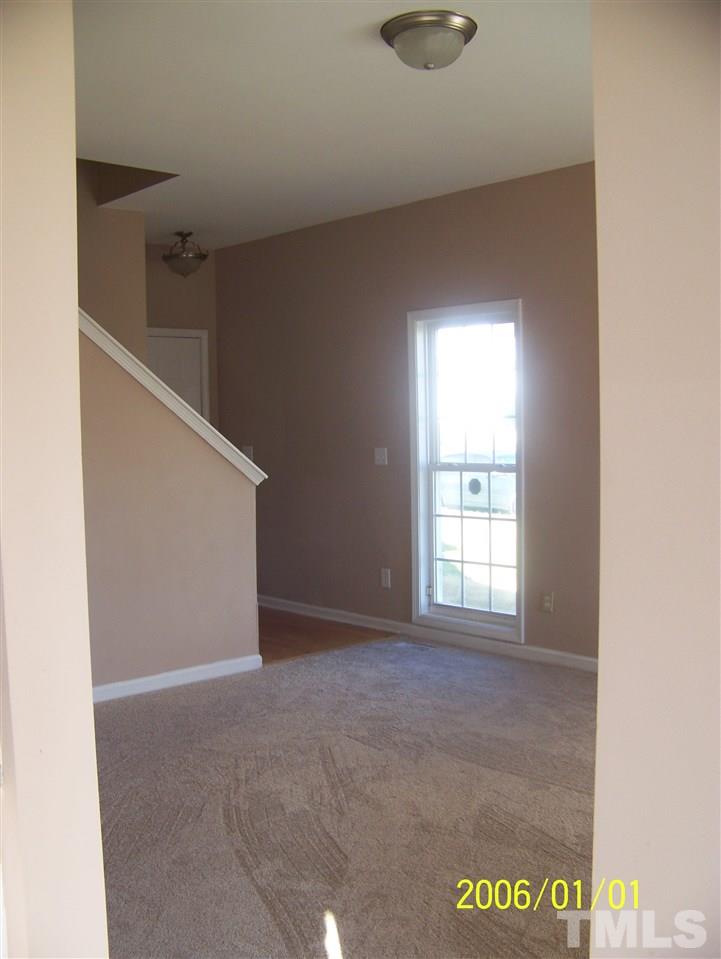 4244 Beacon Crest Way Raleigh, NC 27604 - Photo 4 of 6 a view of an empty room with a window