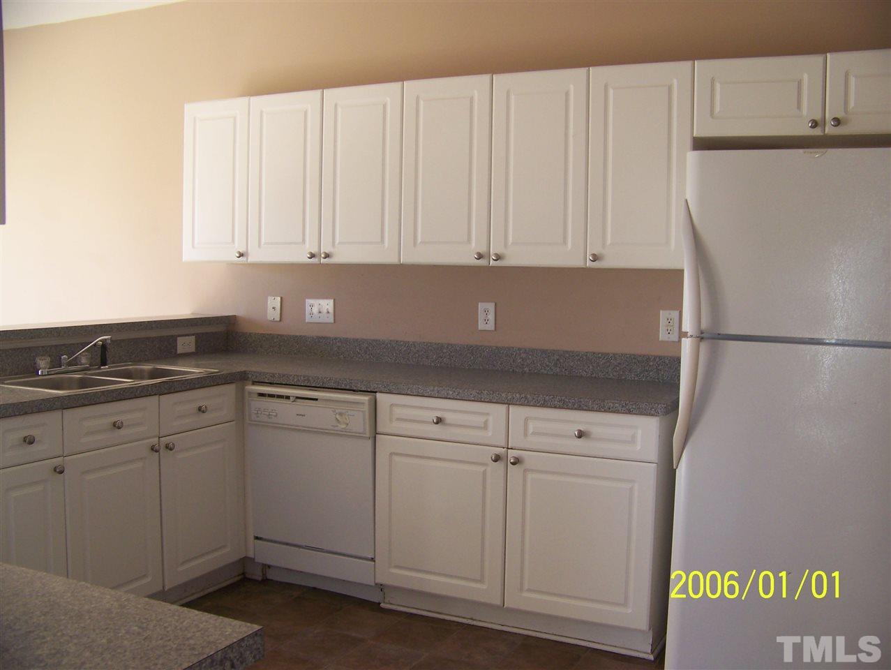 4244 Beacon Crest Way Raleigh, NC 27604 - Photo 6 of 6 a kitchen with a sink and cabinets