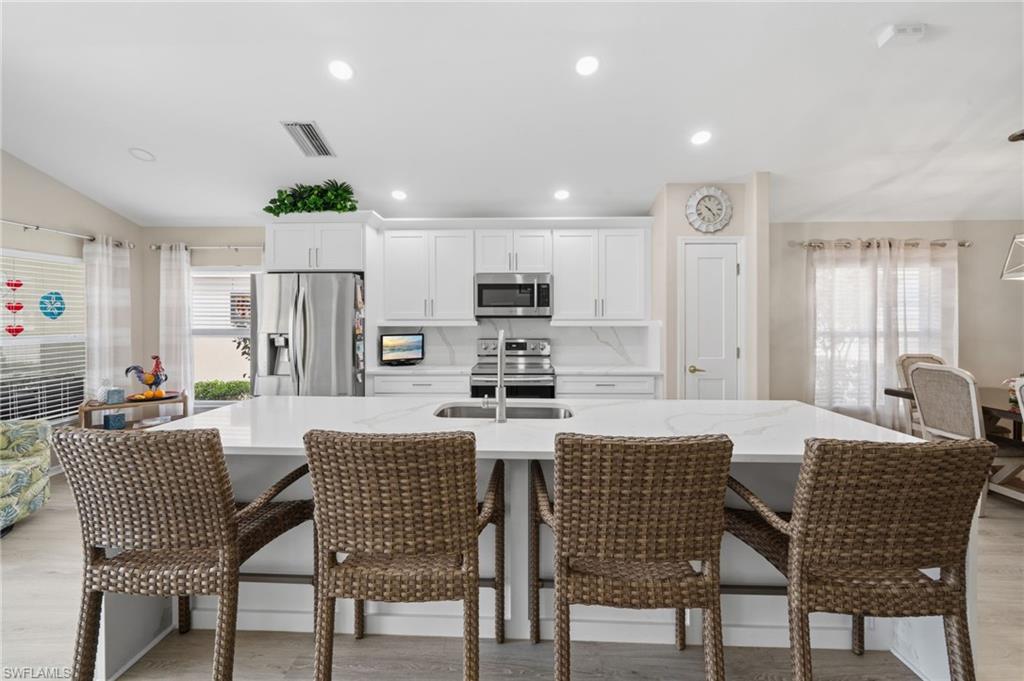 10020 Horse Creek Road Fort Myers, FL 33913 - Photo 16 of 31 a view of a dining room with furniture