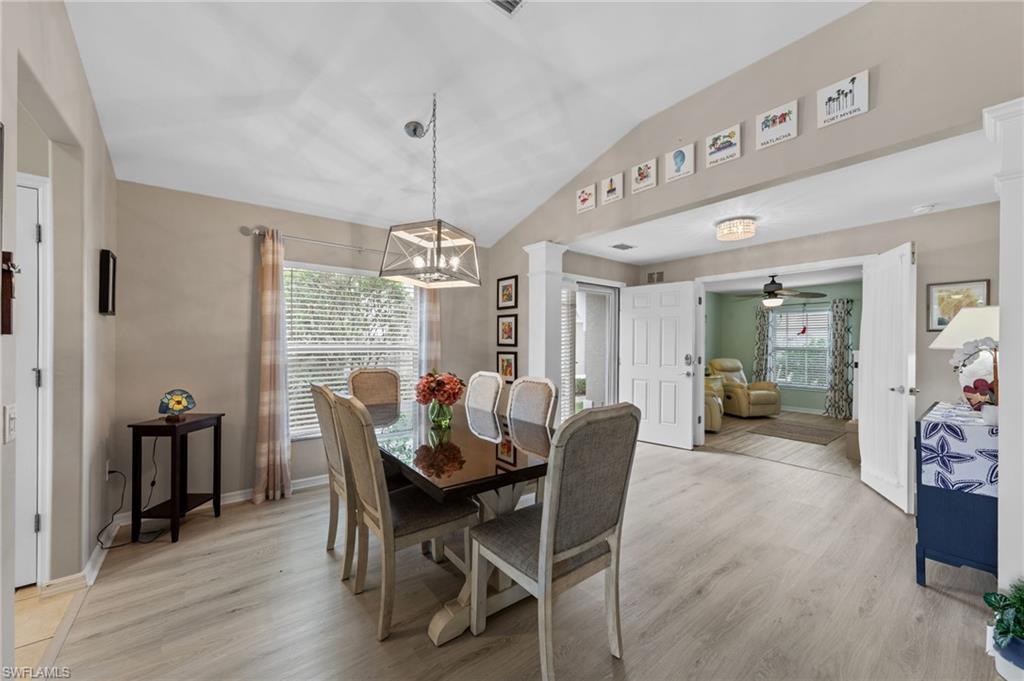 10020 Horse Creek Road Fort Myers, FL 33913 - Photo 17 of 31 a view of a dining room with furniture window and wooden floor