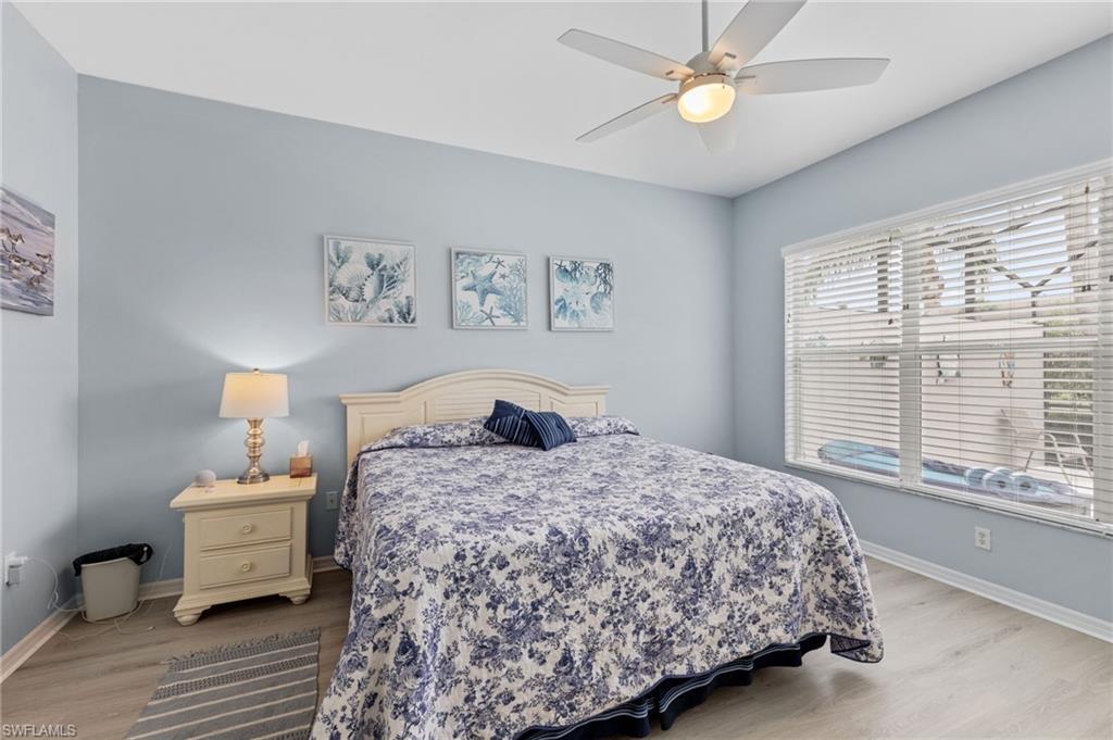 10020 Horse Creek Road Fort Myers, FL 33913 - Photo 18 of 31 a bedroom with a bed and a chandelier