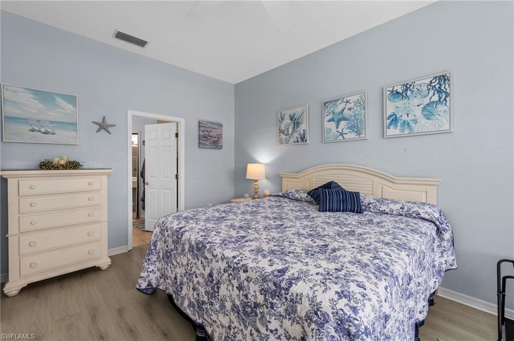 10020 Horse Creek Road Fort Myers, FL 33913 - Photo 19 of 31 a bedroom with a bed and a dresser