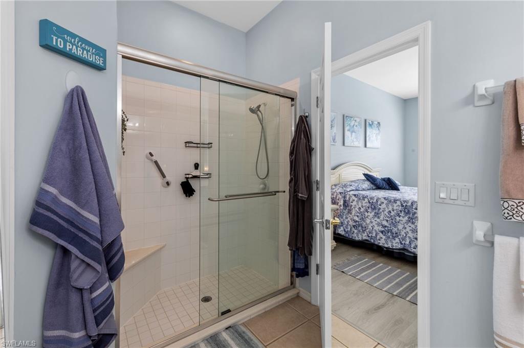 10020 Horse Creek Road Fort Myers, FL 33913 - Photo 21 of 31 a walk in closet with window and a bathroom