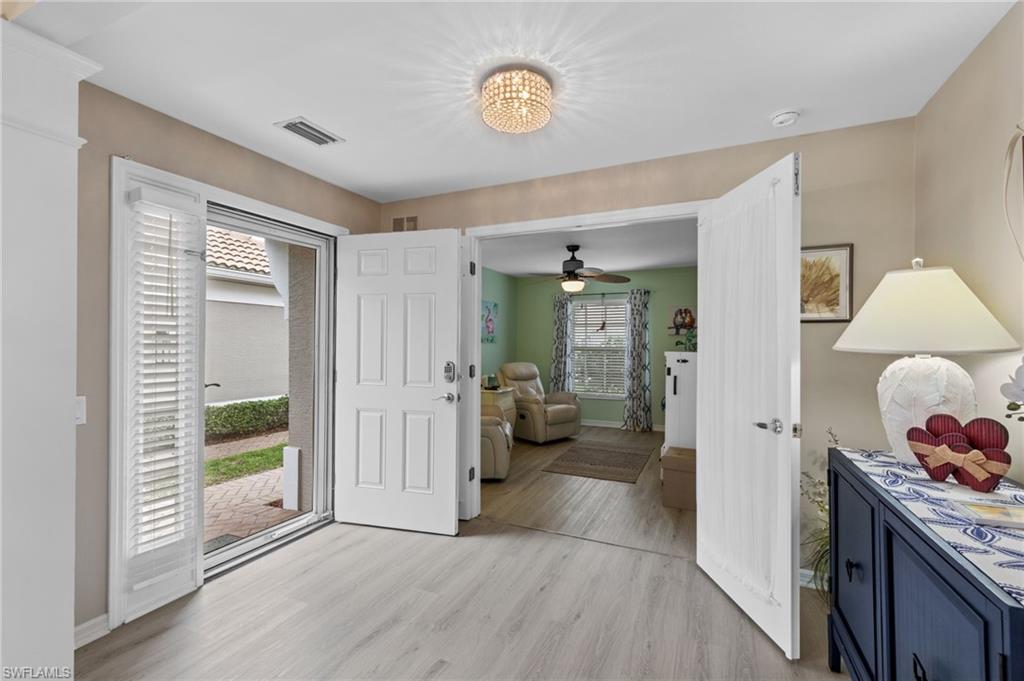 10020 Horse Creek Road Fort Myers, FL 33913 - Photo 24 of 31 a view of an entryway with wooden floor
