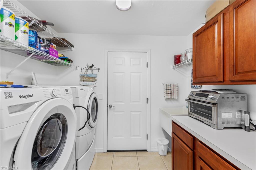 10020 Horse Creek Road Fort Myers, FL 33913 - Photo 26 of 31 a storage room with washer and dryer