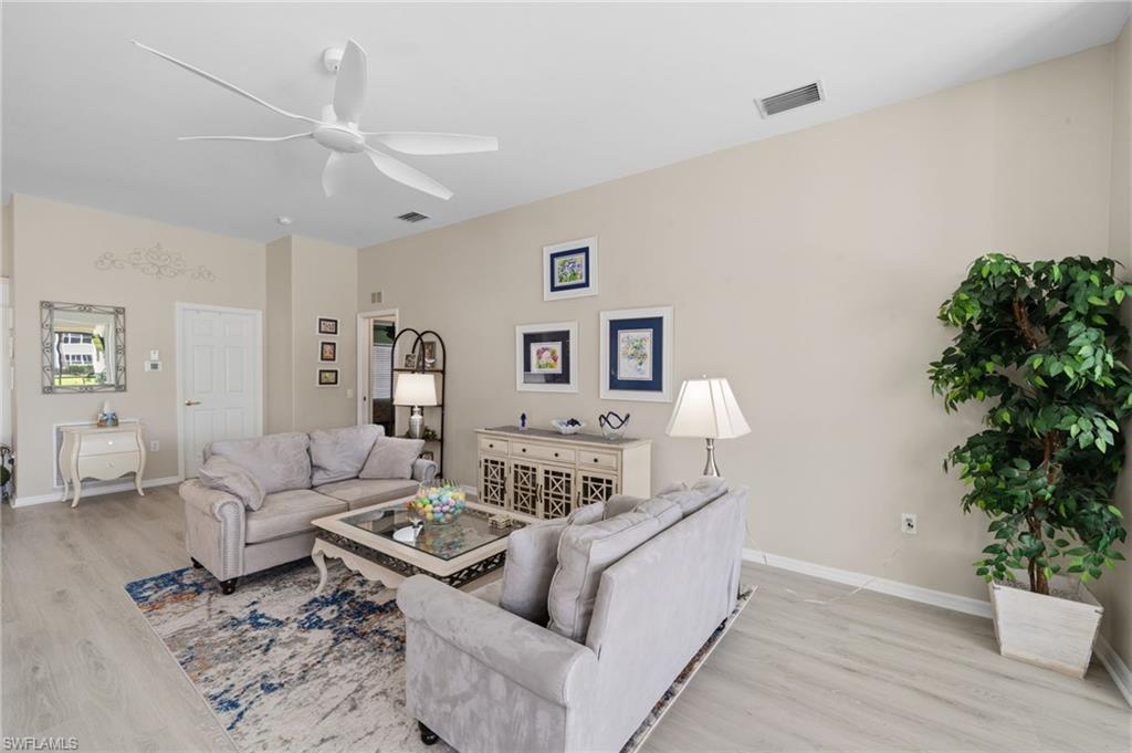 10020 Horse Creek Road Fort Myers, FL 33913 - Photo 3 of 31 a living room with furniture and a potted plant
