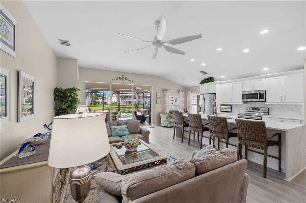 10020 Horse Creek Road Fort Myers, FL 33913 - Photo 4 of 31 a living room with furniture kitchen view and a large window